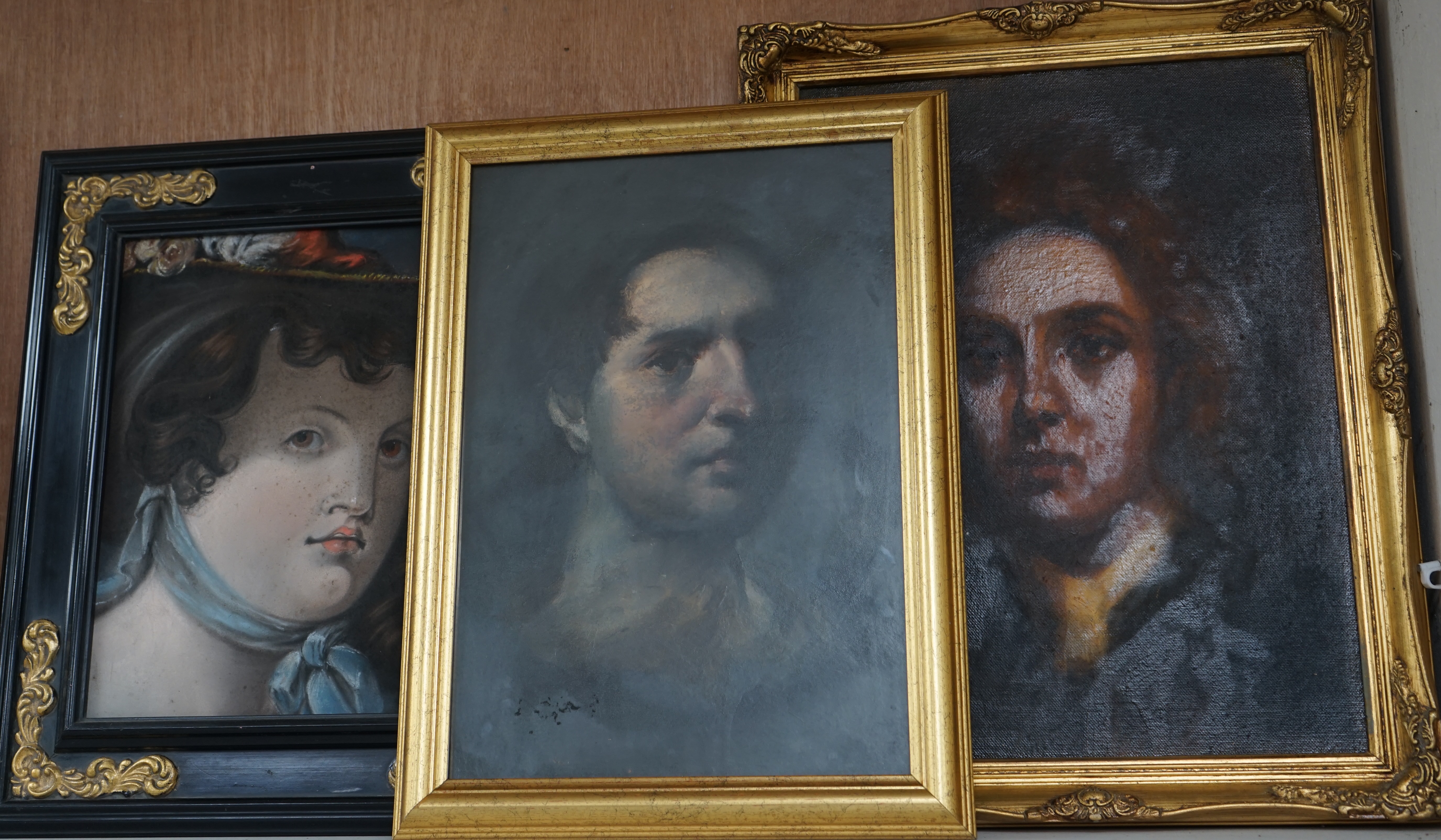 Three portraits to include a pastel, Portrait of a lady wearing a bonnet and an oil on canvas board, Portrait of a Georgian gentleman, 39 x 29cm, gilt framed. Condition - varies, fair to good